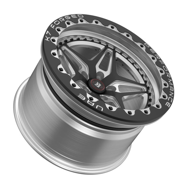K7 Forged DRG-722B — B-series beadlock black ring with K7 FORGED / PERFORMANCE / UAE lettering, five-spoke star / split-V face — front three-quarter hero